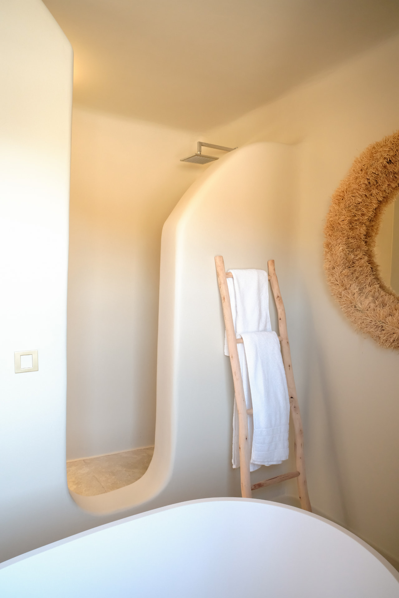 The Master Suite bathroom, sculptural curved shower and towel ladder