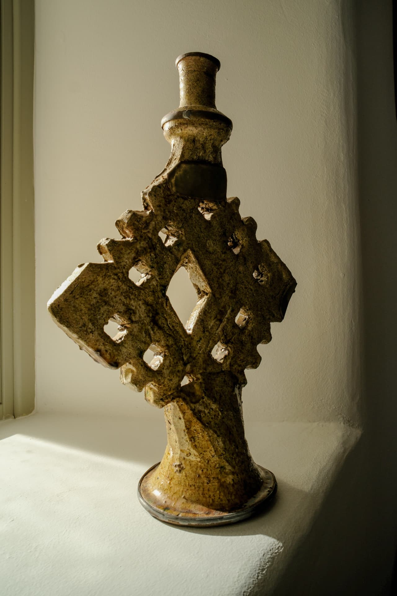 Detail, handcrafted ceramic vessel on the windowsill of the Stone Shepherd's House