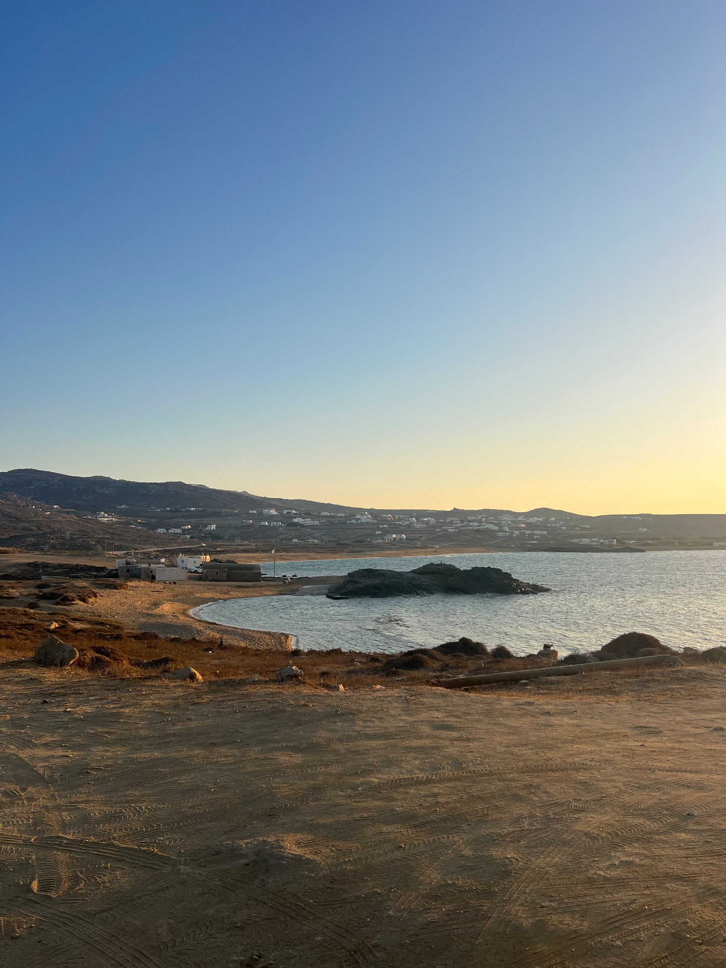 Crescent bay at sunset near Ftelia, Mykonos